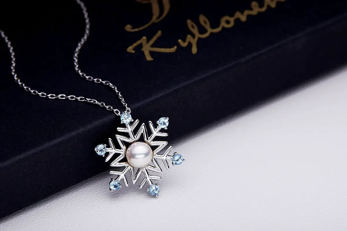 Enchanted Disney Fine Jewelry Elsa's Snowflake Diamond and Aquamarine Drop  Pendant 1/20ctw | REEDS Jewelers